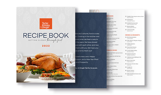 Cover and inside pages of a 2022 recipe book titled "Recipe Book: Getting Closer Through Food," featuring a roasted turkey and a table setting. The inside page lists various categories and recipes.